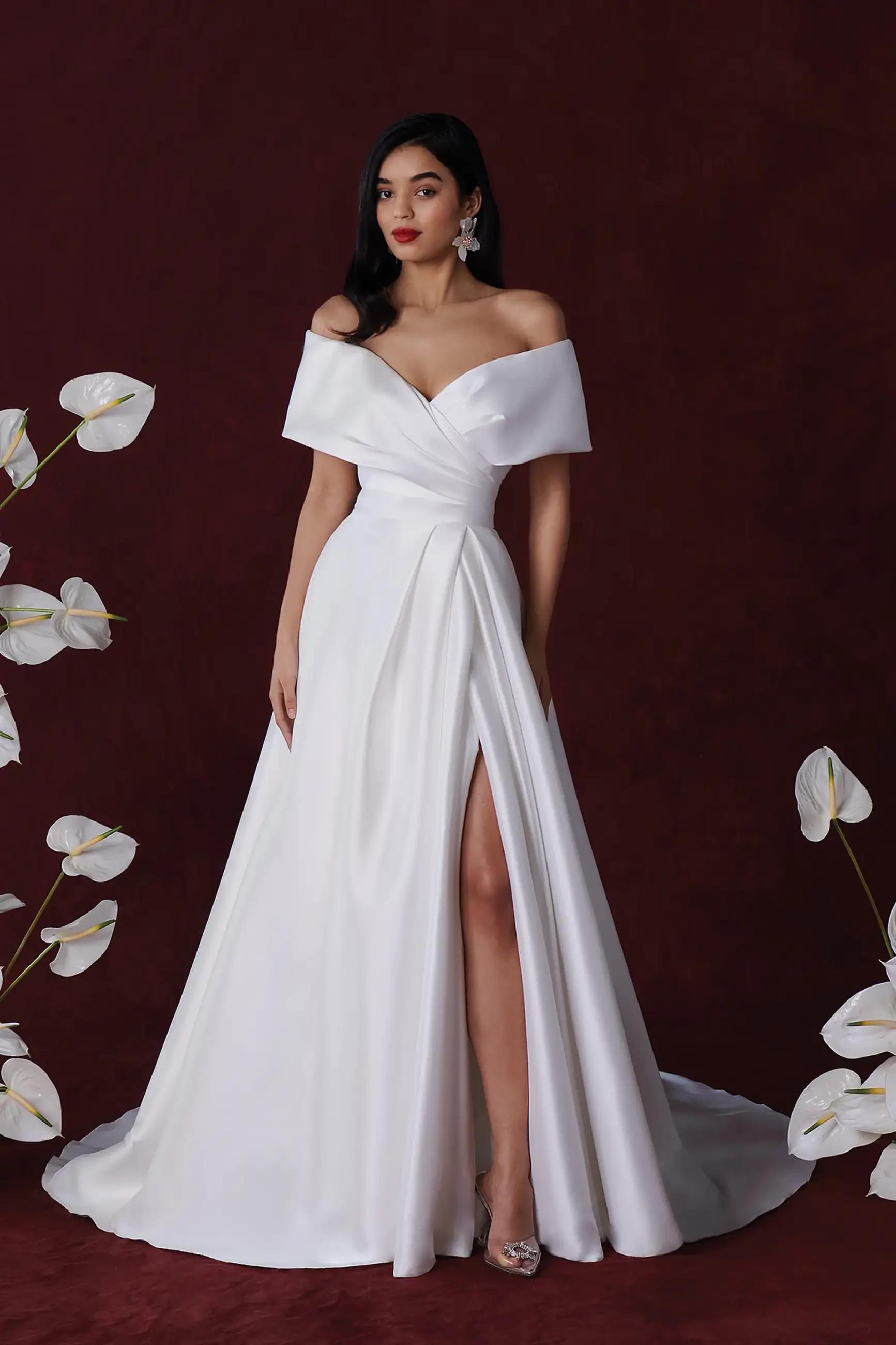 Model wearing a white gown by Justin Alexander